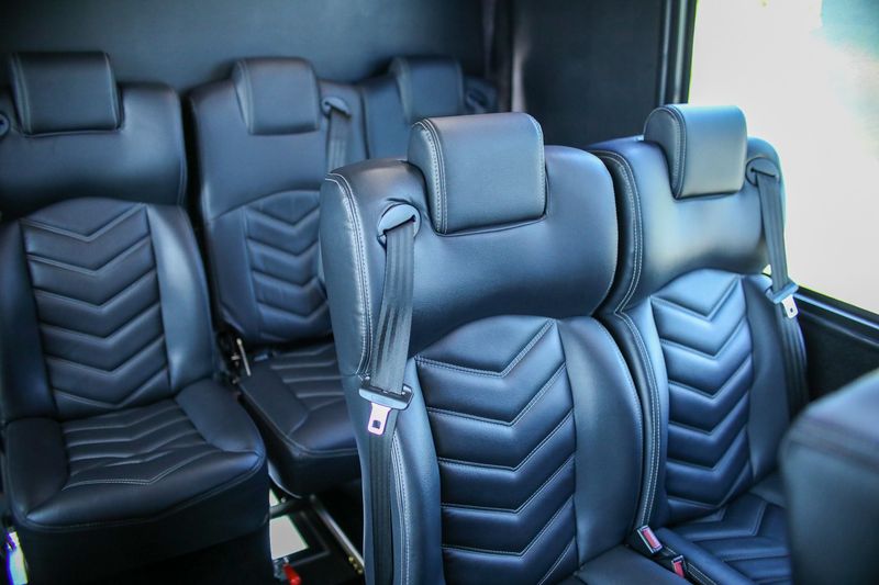 modern-white-41-passenger-mini-bus-interior-leather-seats-on-an-angle