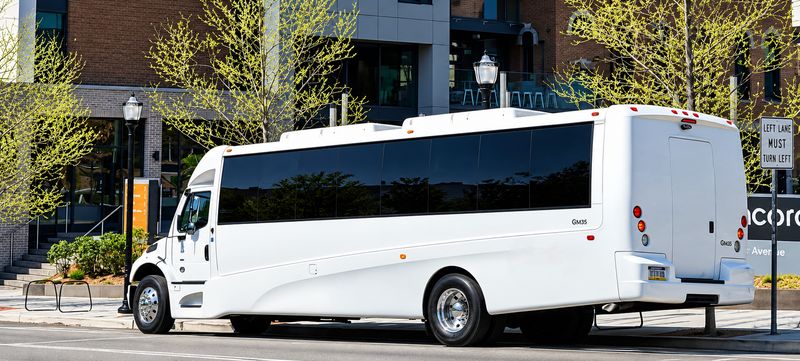 modern-white-41-passenger-mini-bus-exterior-on-street